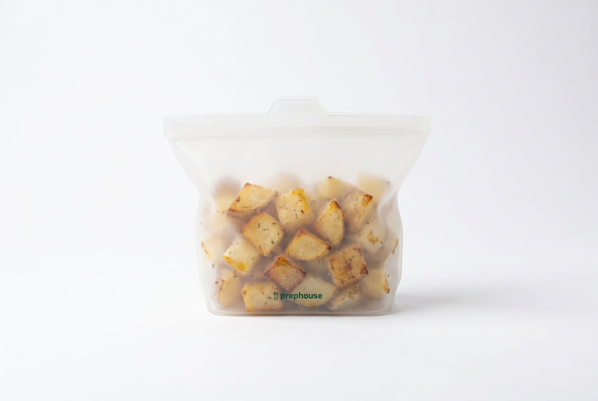 Silicone bag with roasted potato cubes — meal-prep leftovers
